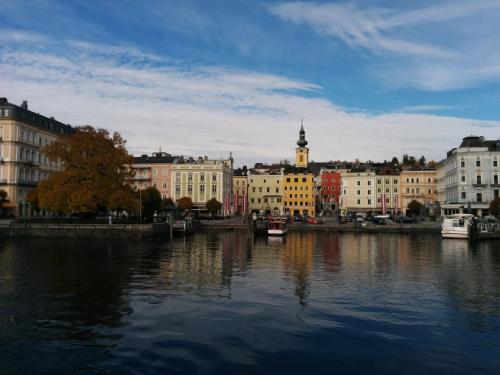 a view of a city with a river and buildings at Ferienwohnungen Blockhaus - Zwergenhäusl Grünau im Almtal in Grünau im Almtal