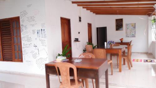 a dining room with a table and some chairs at Disna Homestay in Habarana