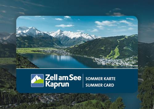 a picture of a lake with mountains in the background at Berg- & Seeblick Pfefferbauer in Zell am See
