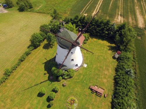 an aerial view of a windmill in a field at Windmill vacation home in Ledzin near Baltic Sea in Niechorze