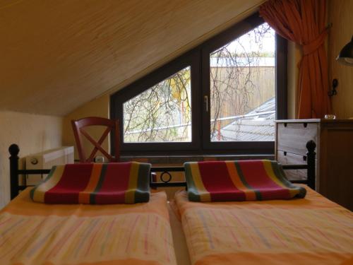 Postel nebo postele na pokoji v ubytování Försters Weinterrassen