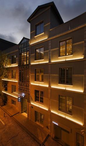 a building with lights on the side of it at Fer Hotel in Istanbul