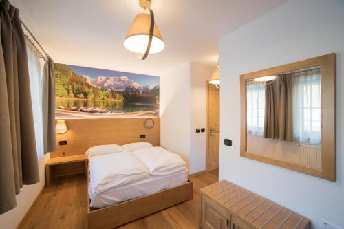 Un pat sau paturi într-o cameră la Hotel Sogni D'Oro