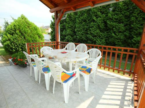 a white table and chairs on a patio at Holiday Home Greenie by Interhome in Balatonszárszó