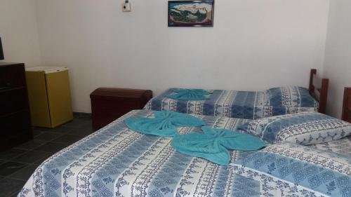 Postel nebo postele na pokoji v ubytování Lagoa Encantada I