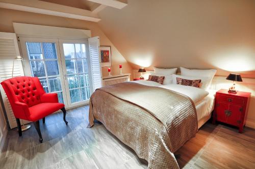 En eller flere senge i et værelse på Ferienhaus Horstweg 5