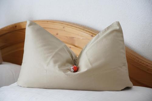 a pillow shaped like a crown sitting on top of a bed at Haus Arnold Schranz in Sankt Anton am Arlberg
