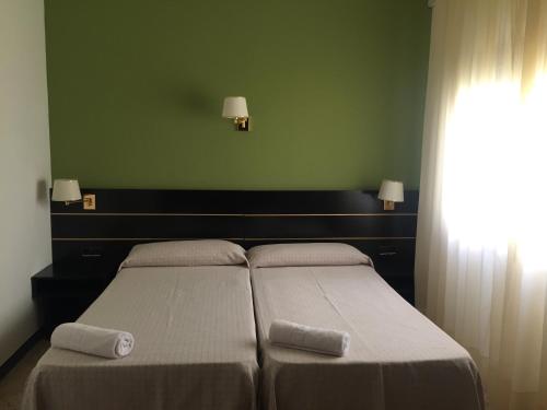 Hotel Proa Astorにあるベッド