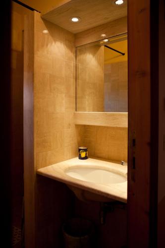 a bathroom with a sink and a mirror at Antico Giuncheto in Magione