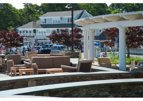 a seating area with chairs and a pavilion at Hyannis Harbor Hotel in Hyannis