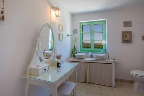 a bathroom with two sinks and a mirror at Villa Tribalj in Tribalj