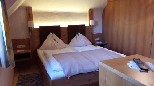 A bed or beds in a room at Pension - Bauernhof