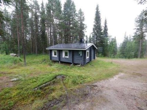 a small cabin in the middle of a field at Holiday Home Ravelin by Interhome in Ylläsjärvi