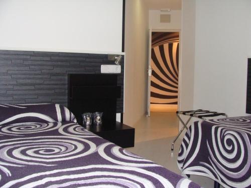 Postel nebo postele na pokoji v ubytování Hostal JQ Madrid 1