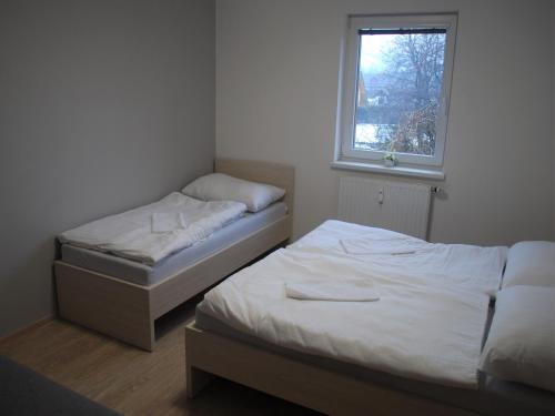 Postel nebo postele na pokoji v ubytování Apartmán U Zámku