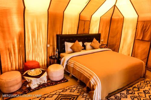 Postelja oz. postelje v sobi nastanitve Merzouga Luxury Bivouac