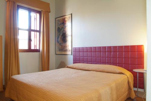 Postel nebo postele na pokoji v ubytování Hotel Maxim