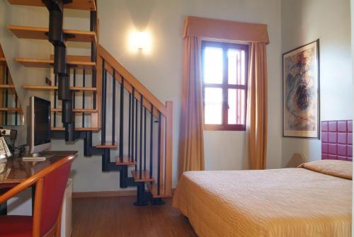 Postel nebo postele na pokoji v ubytování Hotel Maxim