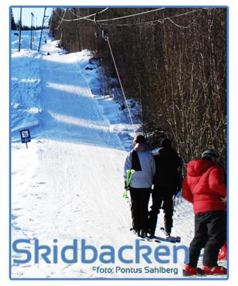 three people walking down a snow covered ski slope at Christinagården Guesthouse in Ramsele
