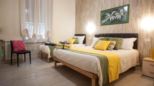 Postel nebo postele na pokoji v ubytování Il Quadrifoglio guesthouse