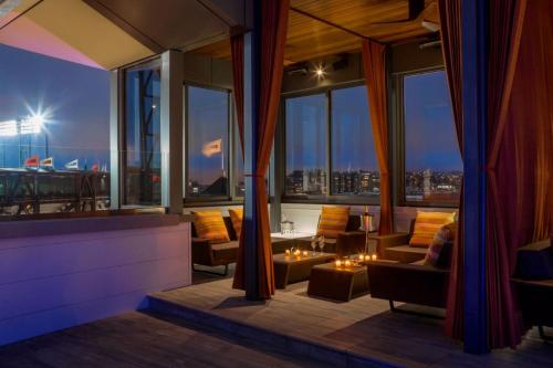a living room with a view of a city at Hotel Via in San Francisco