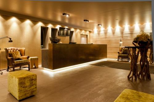 a lobby with a reception desk and chairs at Das Vesper in Sprockhövel