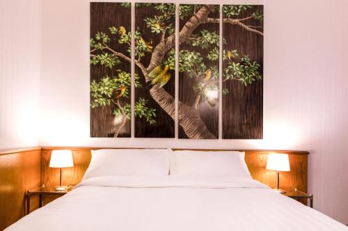 Postel nebo postele na pokoji v ubytování Hotel Sagitta