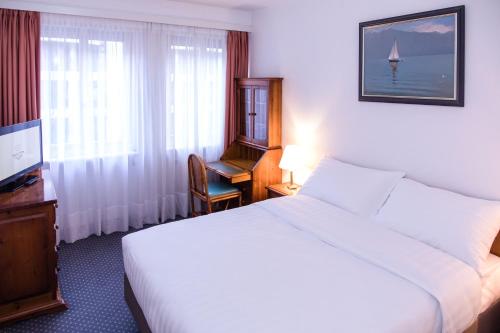 Postel nebo postele na pokoji v ubytování Hotel Sagitta