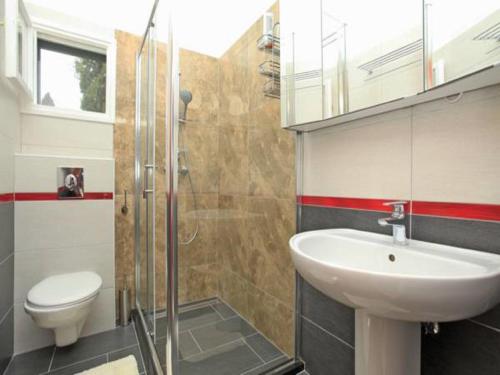 a bathroom with a sink and a toilet at Villa Nova in Vela Luka