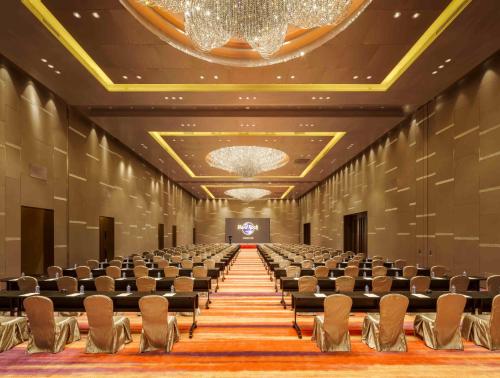 an empty conference room with chairs and a stage at Hard Rock Hotel Shenzhen in Shenzhen