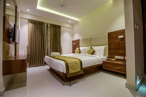 Cama o camas de una habitación en Hotel Tranquil Manipal