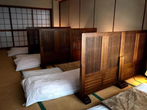 Postel nebo postele na pokoji v ubytování Oyado Matsubaya