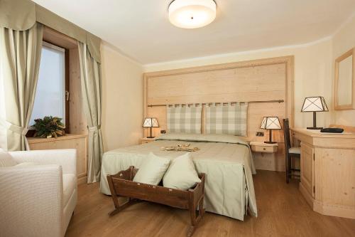 Postel nebo postele na pokoji v ubytování Hotel Edelweiss 3 Stelle SUPERIOR