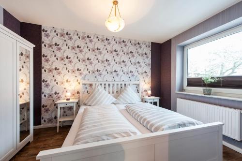מיטה או מיטות בחדר ב-Lotsenhaus