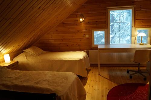 En eller flere senge i et værelse på Heidihaus