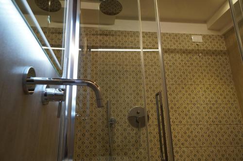 a shower with a glass door in a bathroom at P 1779 in Venice