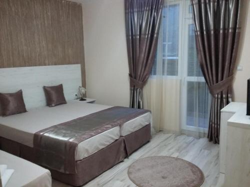 Lova arba lovos apgyvendinimo įstaigoje Guest House Adriya