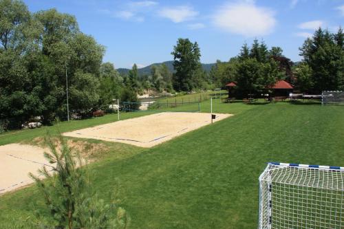 an empty soccer field with a goal in the grass at B&B Pri Peclju in Podgrad