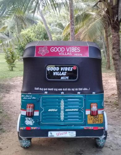a blue bus with avertisement at Good Vibes Villas in Unawatuna