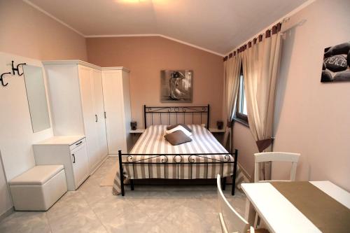 Ένα ή περισσότερα κρεβάτια σε δωμάτιο στο Guest House Navetta