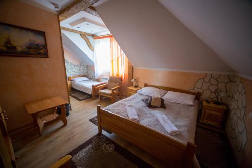 מיטה או מיטות בחדר ב-Hotel & Spa Arkadia