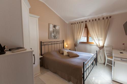 Ένα ή περισσότερα κρεβάτια σε δωμάτιο στο Guest House Navetta