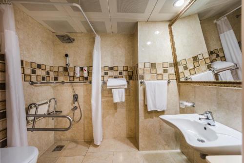 a bathroom with a sink and a shower at Club Nena - All Inclusive in Kizilagac