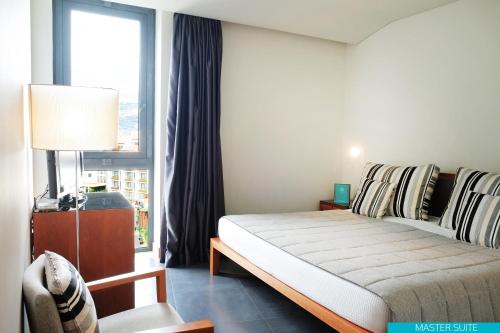 
A bed or beds in a room at VidaMar Resort Hotel Madeira - Dine Around Half Board
