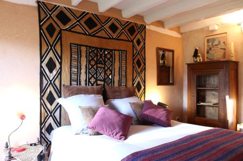 Un pat sau paturi într-o cameră la Le bourgis