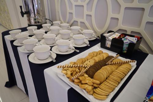 a long table with plates of food on it at Hotel Posada Señorial in Cholula
