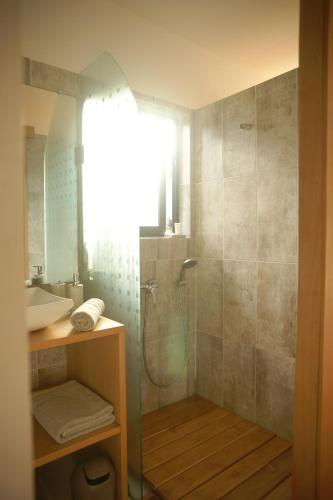 a bathroom with a shower and a sink at Quai 40 in Abidjan