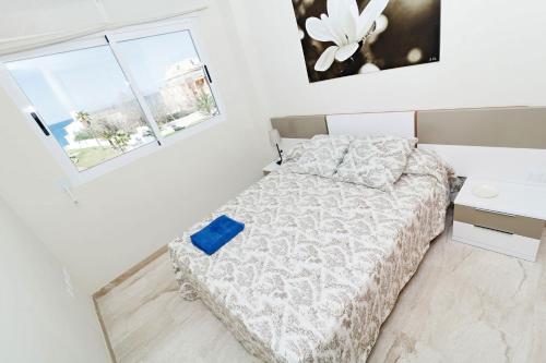 En eller flere senge i et værelse på Apartamentos Almadraba VyB