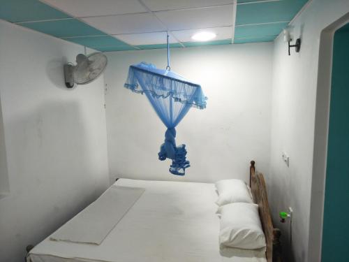 Postel nebo postele na pokoji v ubytování Milkyway Bungalow