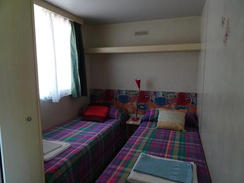 Postel nebo postele na pokoji v ubytování Agriturismo Cascina Le Volpi